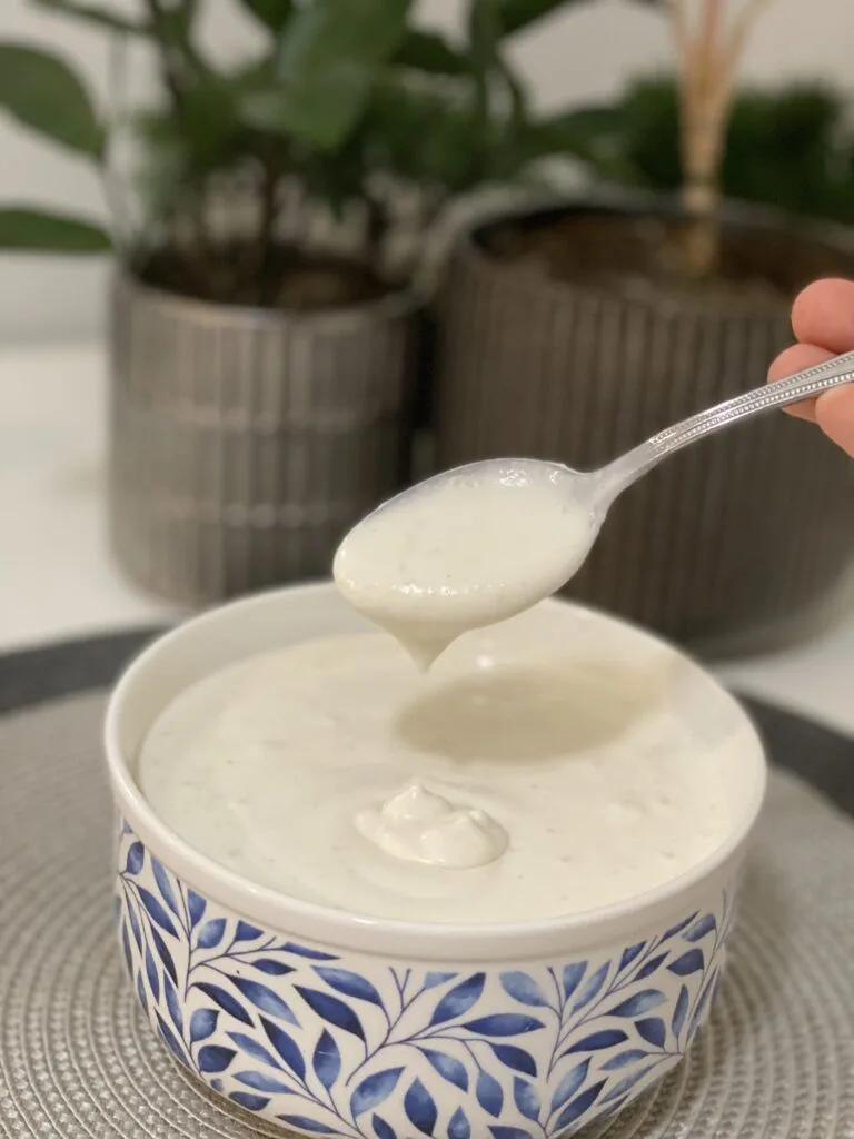 Bowl of creamy filling with a spoon lifting some above it