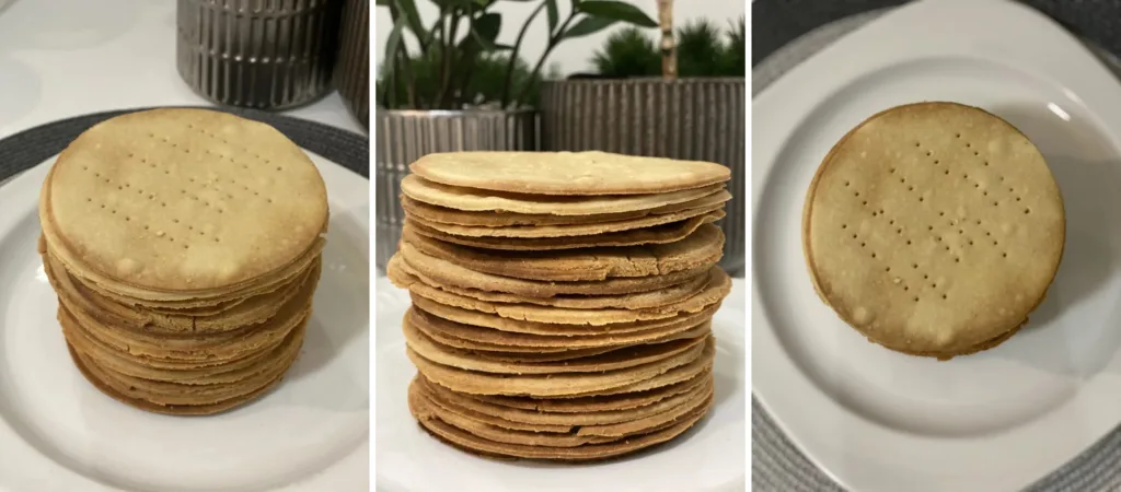 Stack of baked honey cake layers on a plate